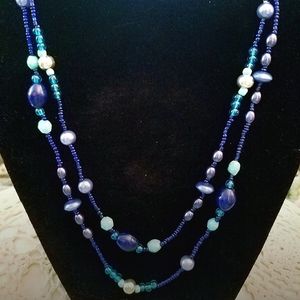 Pre-owned eternity beaded necklace with blue beads.